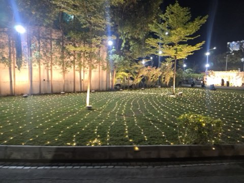 Lawn at Jaithri Grand Convention lit with fairy lights in the evening, Shamshabad